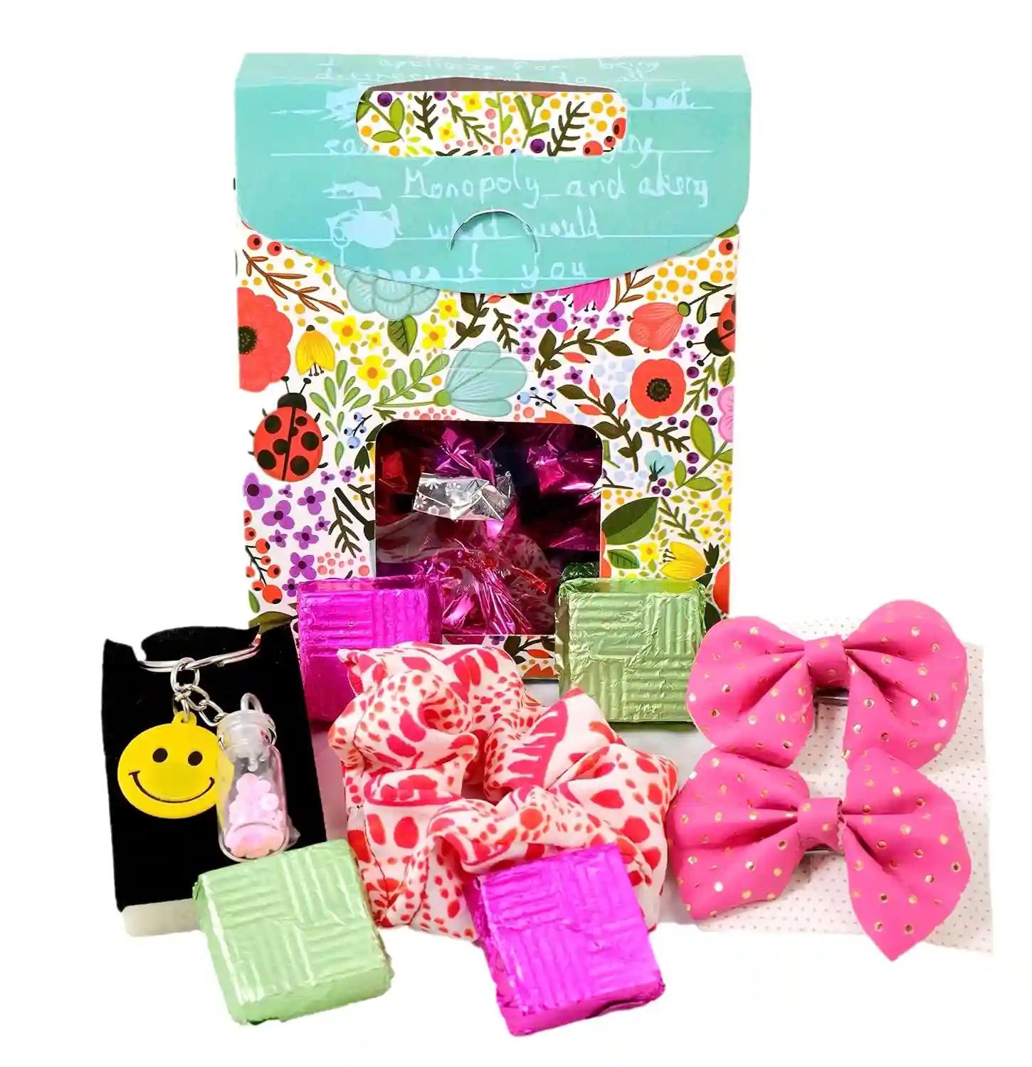 Rakhi Gift For Sister/Raksha Bandhan Gift/Birthday Gift For Sister/Gift For Sister/Gift For Girls/Gift For Women-Bag Shaped Box+Chocolates In A Potli+1 Scrunchy+2 Bow Clips+Key Chain+Best Wishes Card