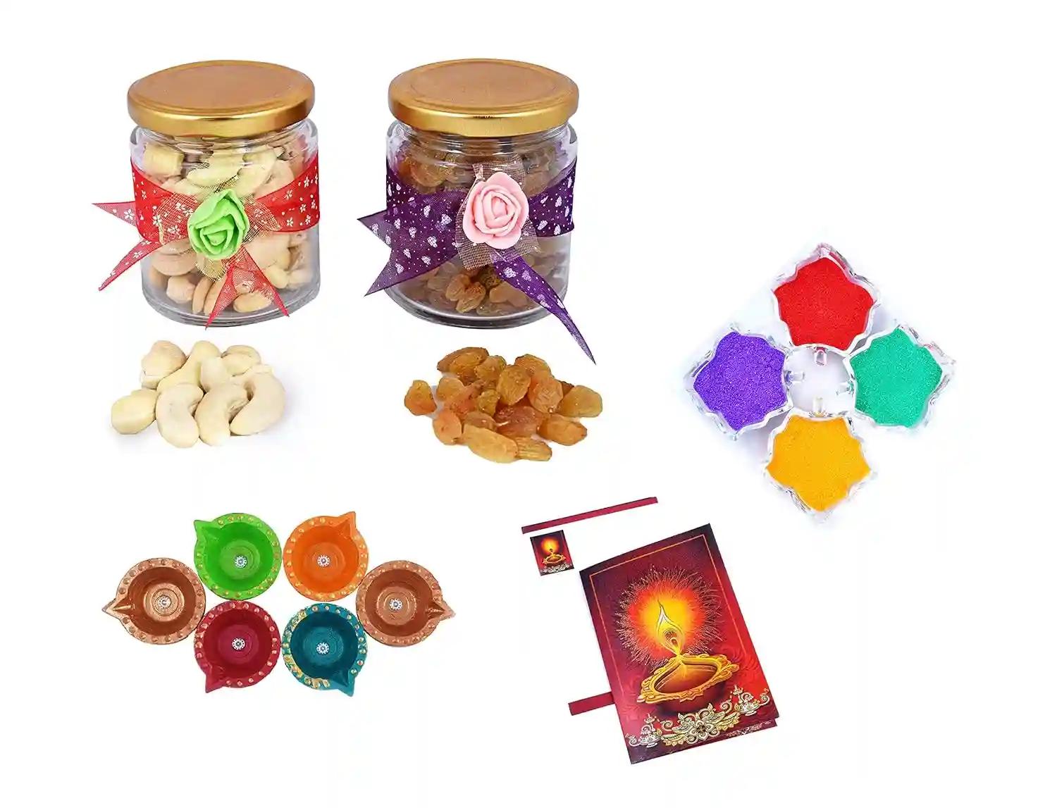 MANTOUSS Diwali Dry Fruit Decorative Glass Jar-Cashew and Raisins(100gms Each),200 GMS + 2 Cute diyas, Rangoli Colours and Diwali Greeting