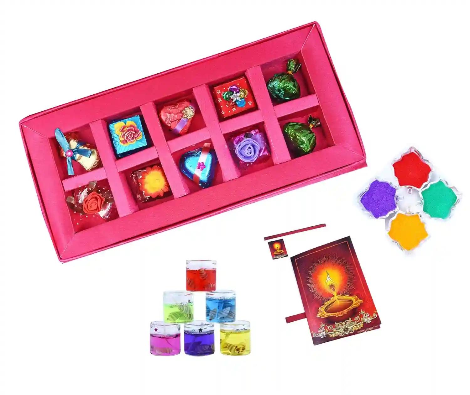 MANTOUSS Diwali Chocolate Gift in Premium Pink Satin Box + 2 Gel Filled Glass Candle, Diwali Greeting Card and Rangoli Colours