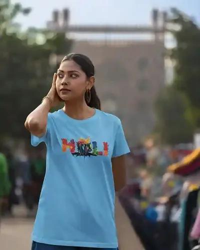 Dynamic Holi Celebration: Vibrant Dance Silhouettes Women's T-Shirt | 100% Premium Bio Wash Cotton T-Shirts - S  (Light Blue)